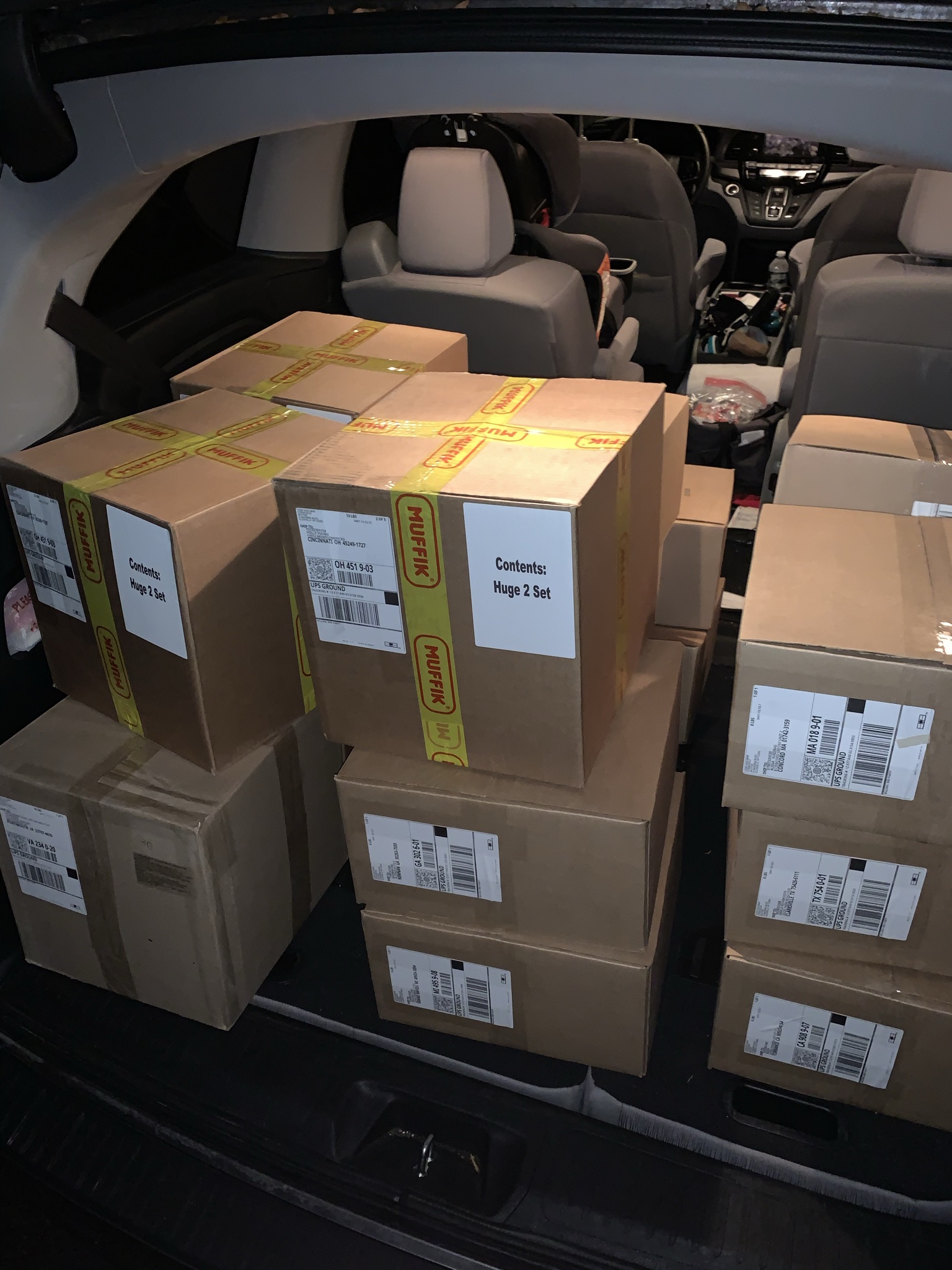 Muffik shipping cartons packed into a vehicle